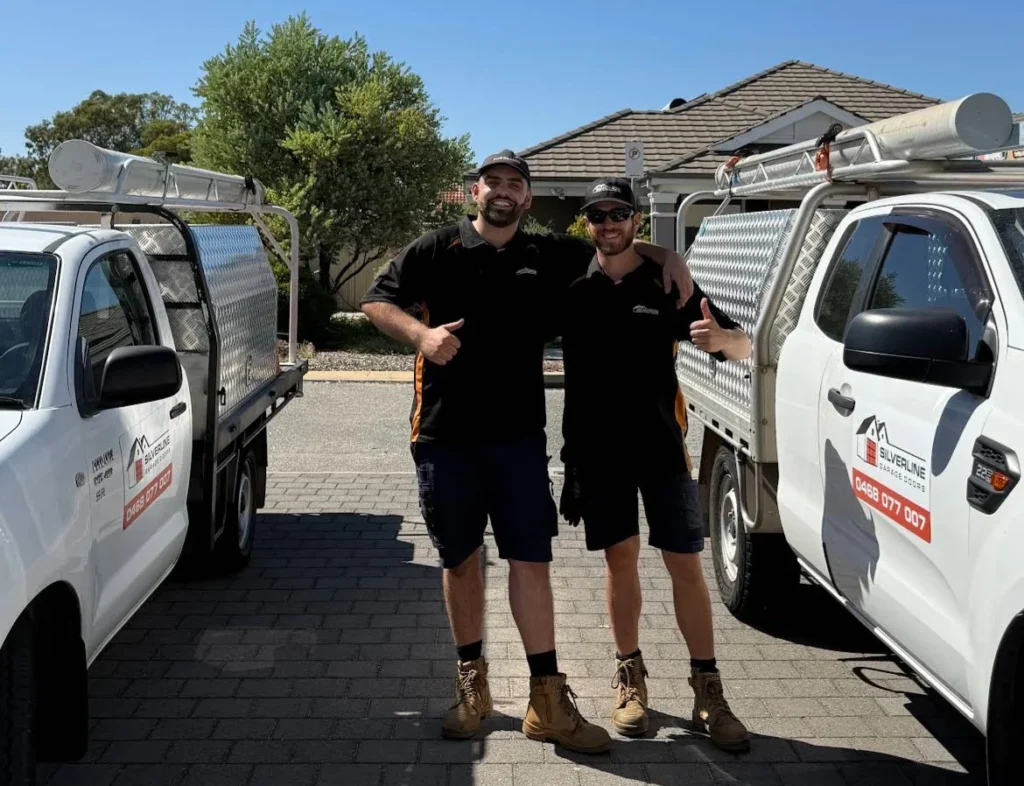 Ron and Loi from Silverline Garage Doors with the company service vehicles in Perth, Western Australia.